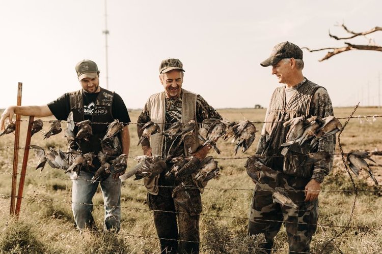 Louisiana gator hunt, line hunt showing three hunters and 4 gators, legally harvested during open season.