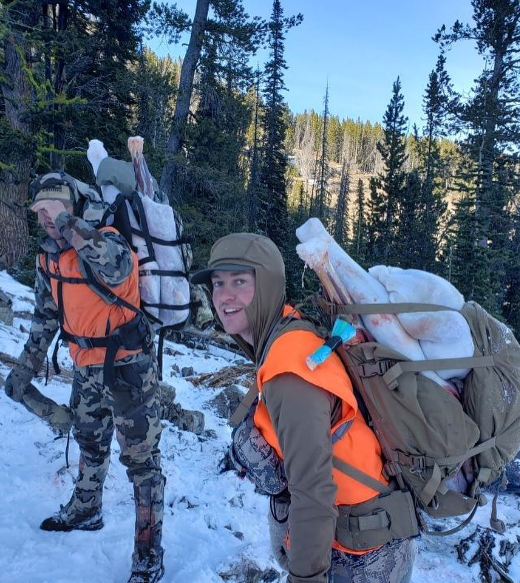 Dillon Montana, Elk Hunt, Packout showing hunters loaded down with meat.