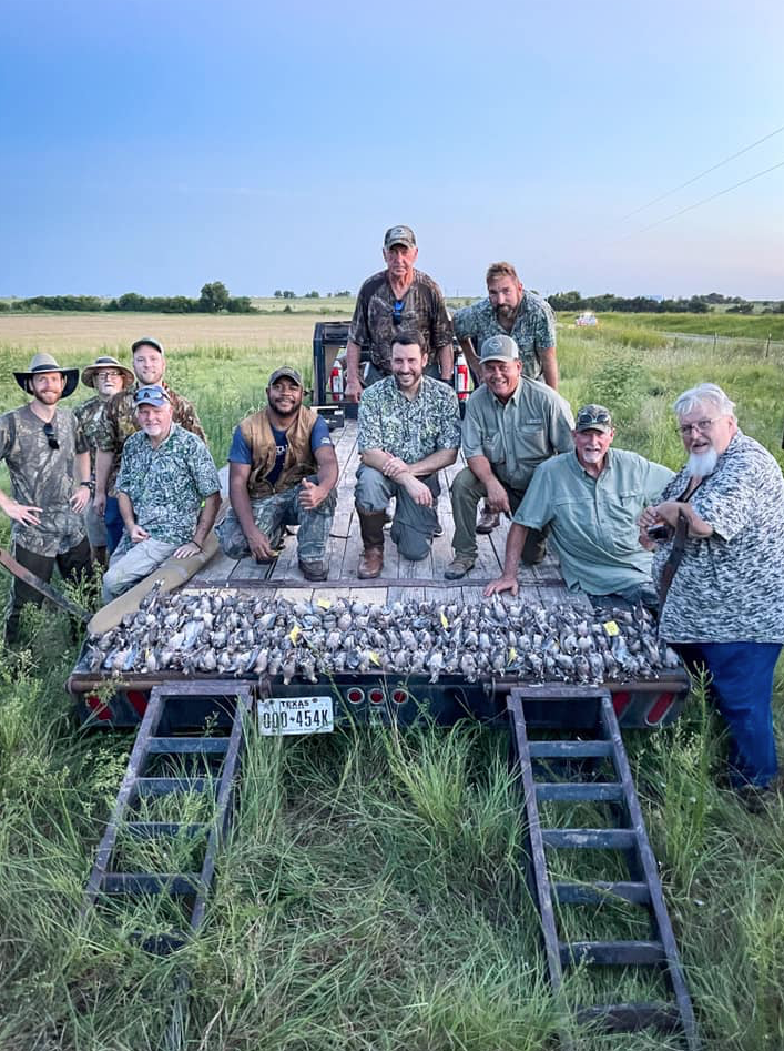 Louisana public land gator hunter shown with three gators.